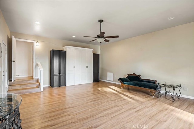 living area featuring recessed lighting, baseboards, a ceiling fan, and light wood finished floors