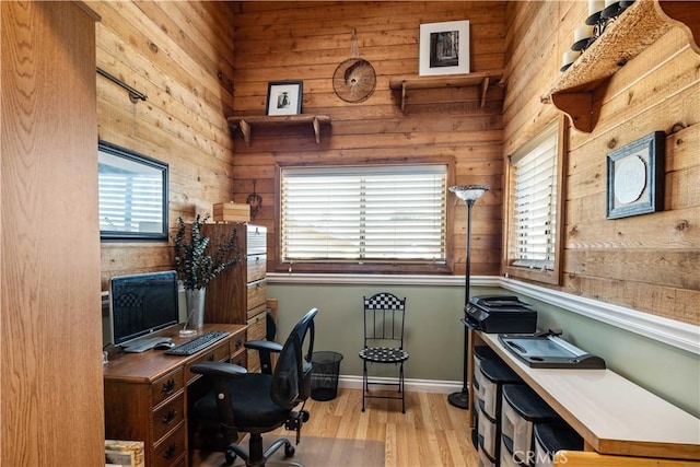 office area featuring baseboards and wood finished floors