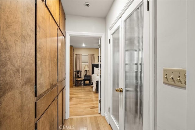 hallway featuring light wood finished floors