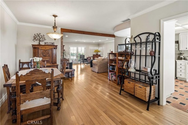 dining room with recessed lighting, visible vents, light wood-style flooring, and crown molding