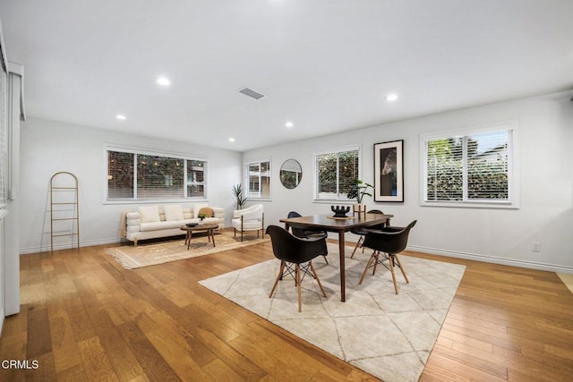 dining room featuring visible vents, recessed lighting, baseboards, and light wood-style floors