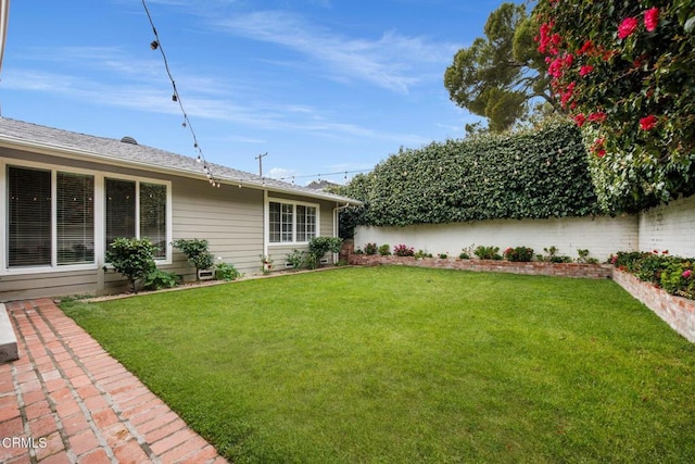 view of yard featuring fence