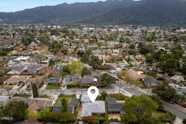 birds eye view of property with a residential view and a mountain view