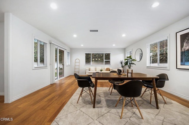 dining space featuring recessed lighting, visible vents, baseboards, and light wood finished floors