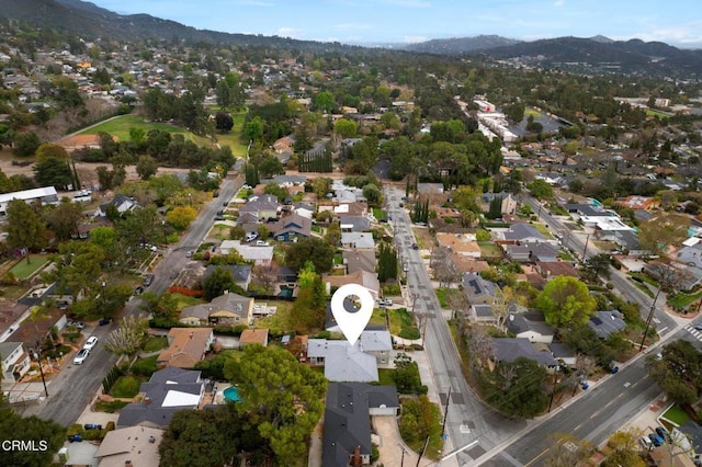 birds eye view of property with a mountain view and a residential view