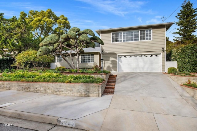 traditional-style home with an attached garage and driveway