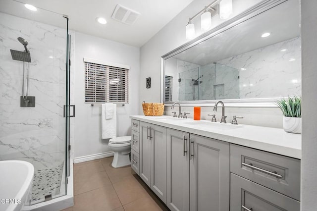 bathroom featuring double vanity, visible vents, a marble finish shower, and a sink