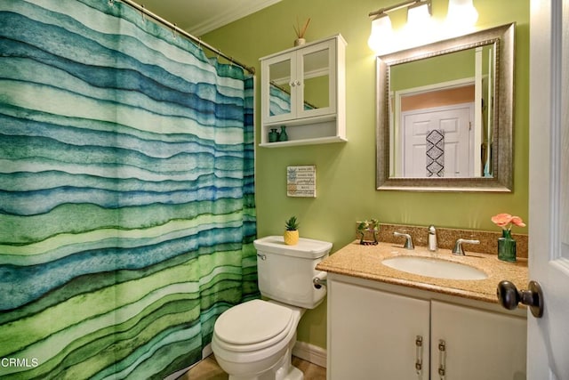 bathroom with vanity, toilet, a shower with curtain, and ornamental molding