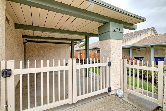 view of gate featuring fence