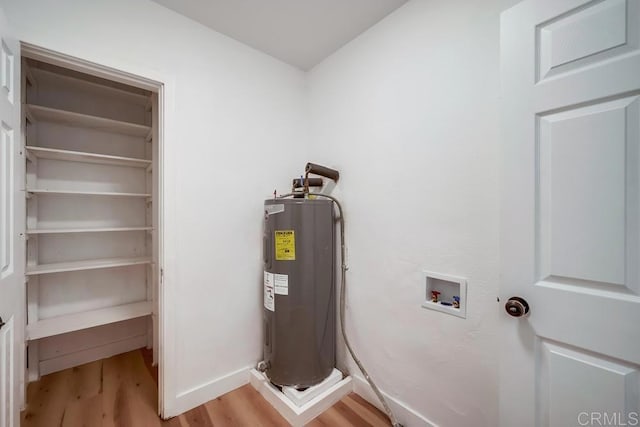 utility room featuring water heater