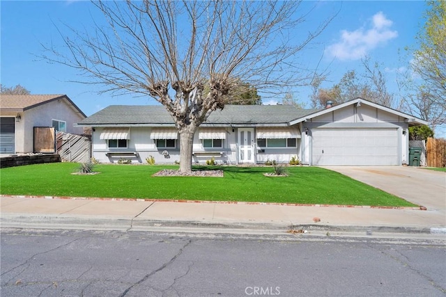 single story home with driveway, an attached garage, a front lawn, and fence