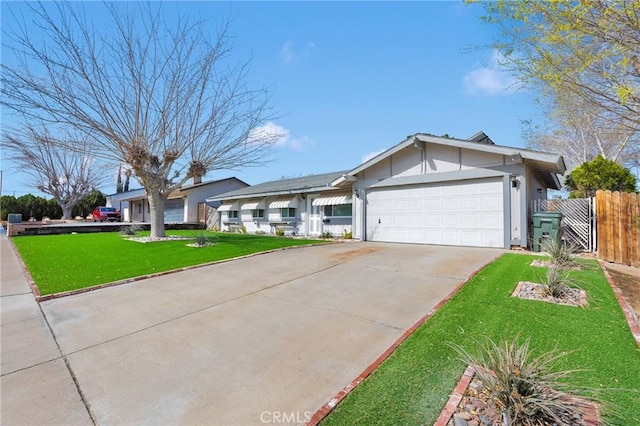 single story home featuring a front yard, fence, a garage, and driveway