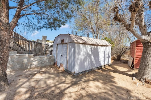 view of shed with a fenced backyard