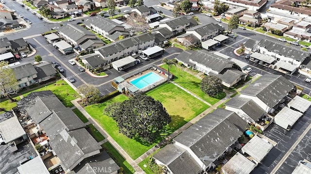 birds eye view of property with a residential view