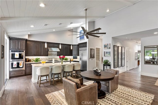 dining area featuring beam ceiling, baseboards, ceiling fan, and dark wood-style flooring