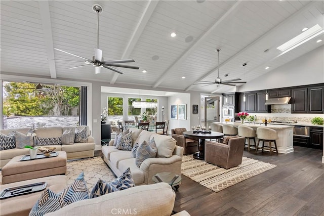 living room with beam ceiling, high vaulted ceiling, a ceiling fan, dark wood-style floors, and recessed lighting