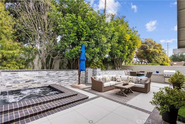 view of patio / terrace featuring area for grilling, an outdoor hangout area, exterior kitchen, and fence