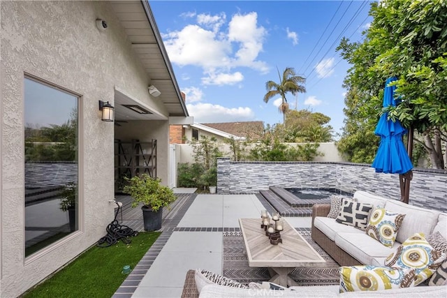 view of patio featuring an outdoor hangout area and a fenced backyard