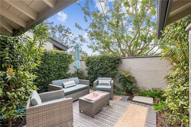 view of patio / terrace with outdoor lounge area and a fenced backyard