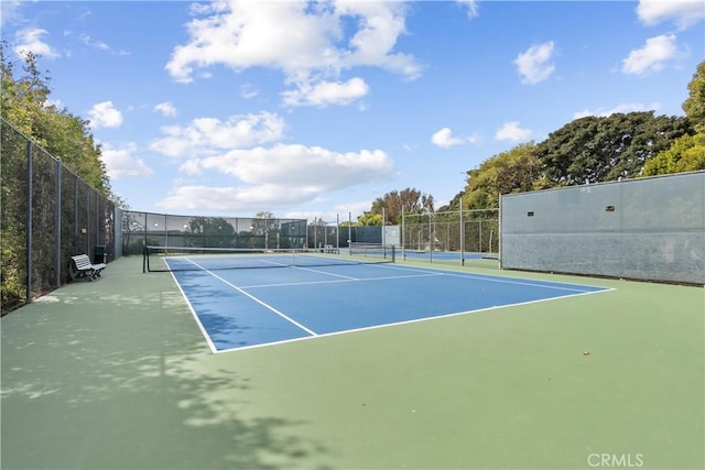 view of sport court with fence