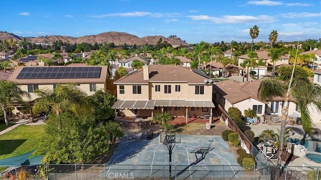 aerial view featuring a mountain view and a residential view