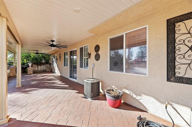 view of patio / terrace with central air condition unit and a ceiling fan