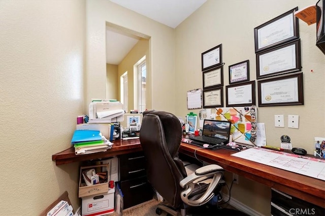 office area featuring a textured wall