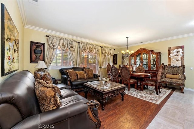 living area featuring an inviting chandelier, wood finished floors, baseboards, and ornamental molding