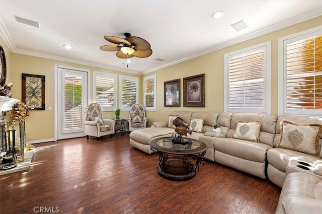 living room with ornamental molding, wood finished floors, and ceiling fan