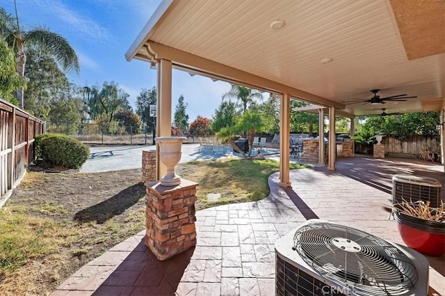 view of patio / terrace featuring cooling unit, a ceiling fan, and a fenced backyard