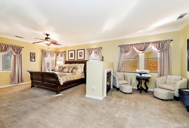 bedroom featuring visible vents, baseboards, carpet, and ceiling fan