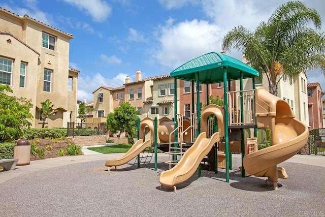 communal playground featuring a residential view