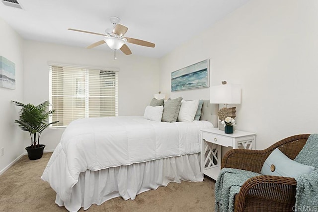 bedroom featuring visible vents, baseboards, light colored carpet, and ceiling fan