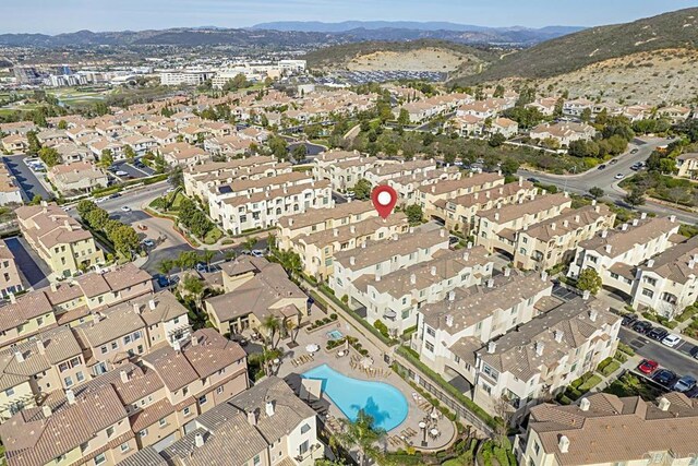 aerial view featuring a mountain view and a residential view