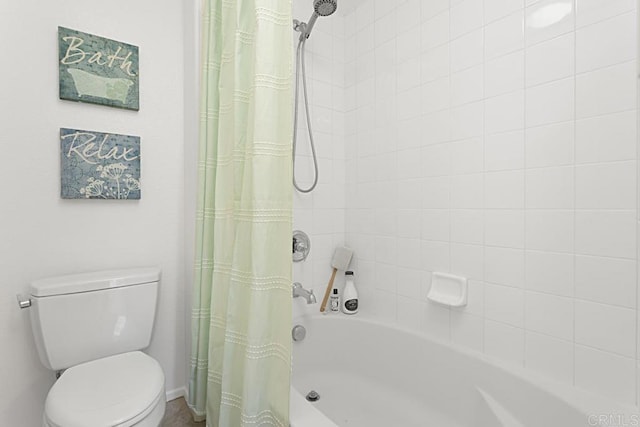 bathroom with toilet and shower / bath combo