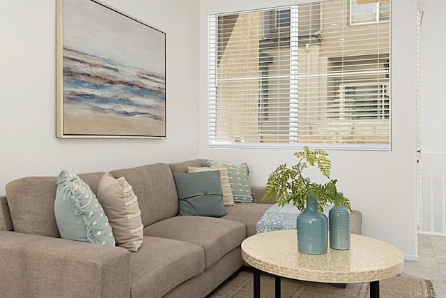 living room with tile patterned flooring and baseboards