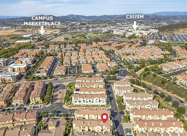 bird's eye view featuring a mountain view and a residential view