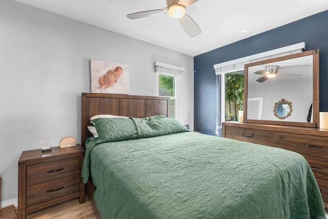 bedroom with wood finished floors and ceiling fan