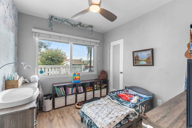 bedroom with wood finished floors and ceiling fan