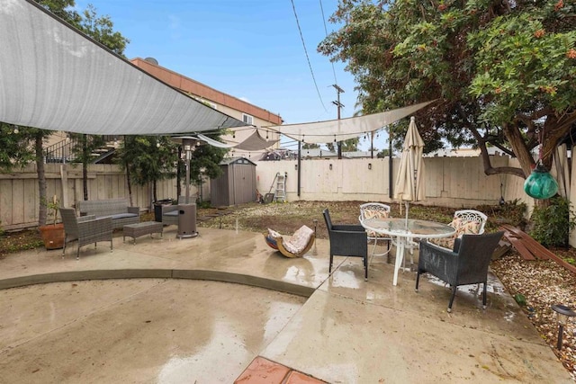 view of patio with outdoor dining space, an outdoor hangout area, and a fenced backyard