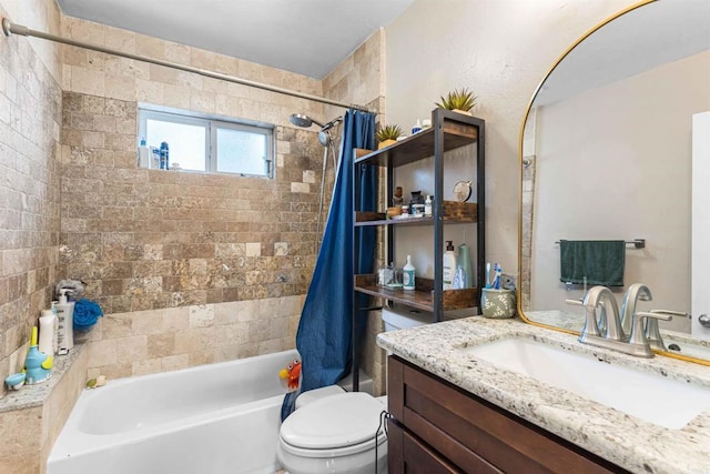 full bathroom with vanity, toilet, and shower / tub combo