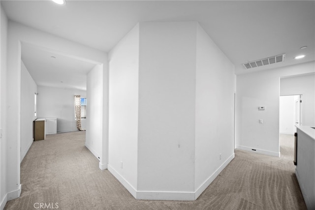 hallway with recessed lighting, visible vents, carpet floors, and baseboards