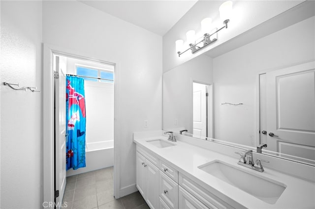 bathroom featuring double vanity, tile patterned flooring, shower / bath combo, and a sink