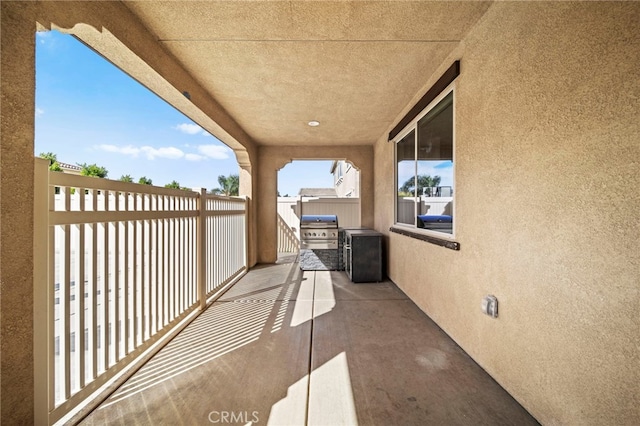 view of patio / terrace with an outdoor kitchen, a balcony, and grilling area