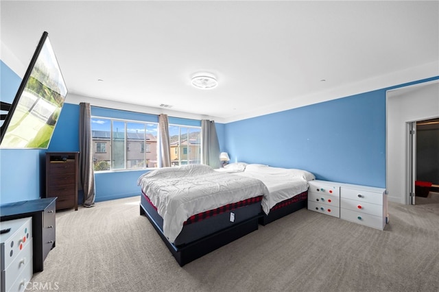 bedroom featuring carpet flooring and visible vents