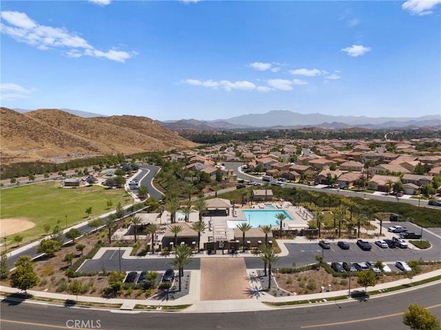 drone / aerial view featuring a residential view and a mountain view