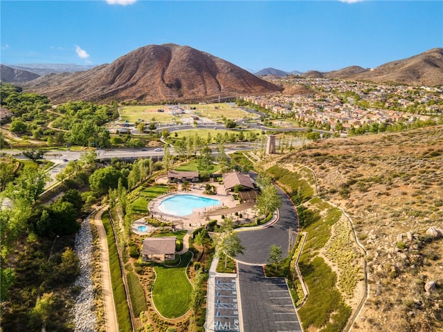 birds eye view of property featuring a mountain view