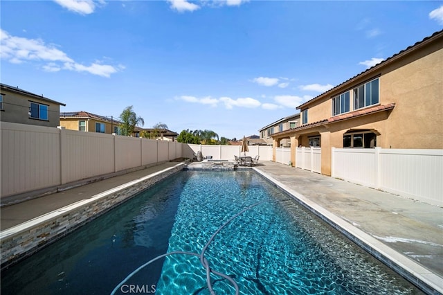 view of pool featuring a fenced backyard, a fenced in pool, and a patio