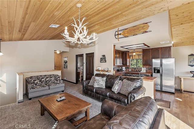 living room featuring lofted ceiling, visible vents, wooden ceiling, and a chandelier