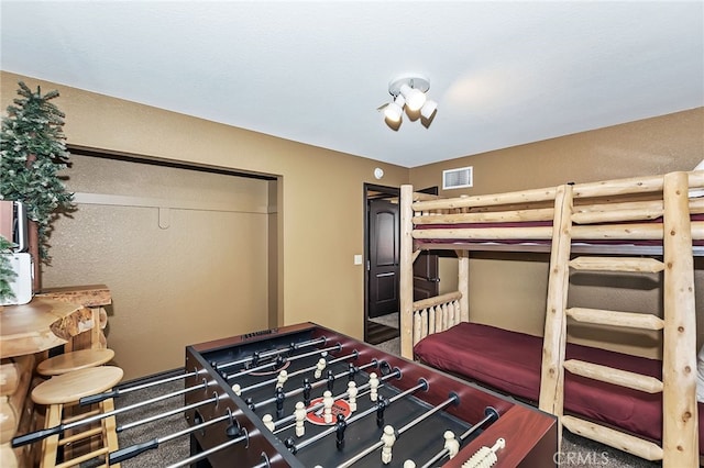 bedroom with a closet and visible vents